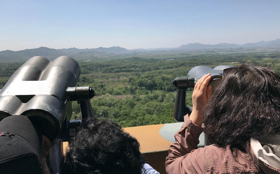Tourists look at North Korea from a viewing platform in South Korea near the Demilitarized Zone, Wednesday, May 24, 2017.