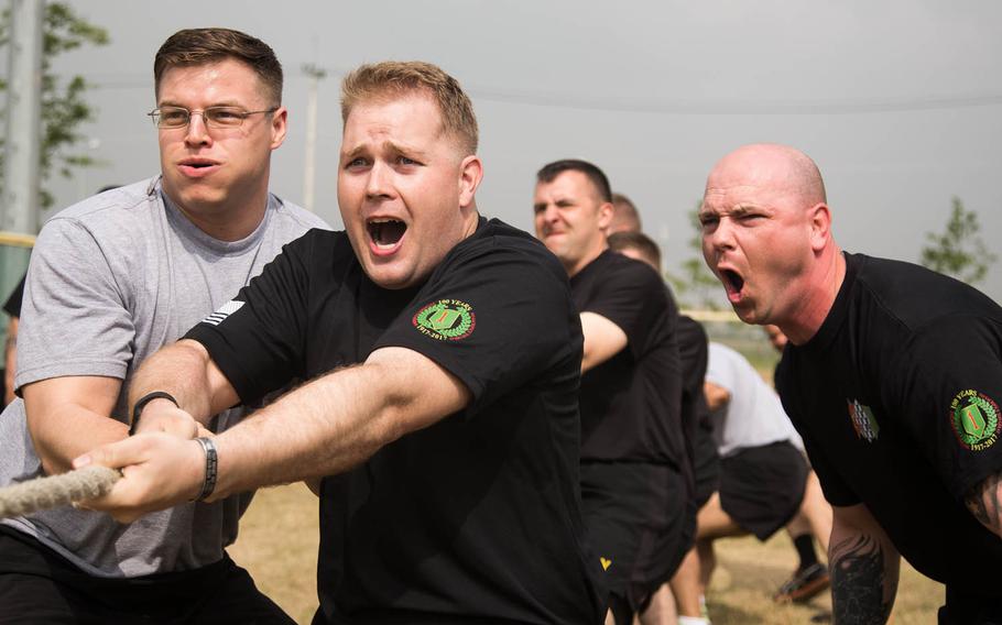 Soldiers compete in tug-of-war during the 1st Armored Brigade Combat Team, 1st Infantry Division's centennial celebration at Camp Humphreys, South Korea, Wednesday, May 24, 2017.
