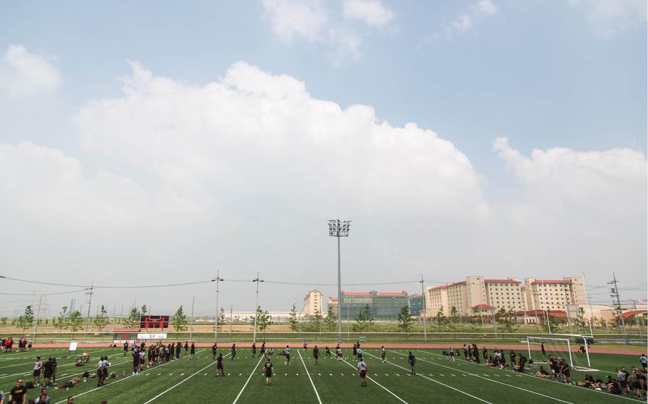 Soldiers play football during the 1st Armored Brigade Combat Team, 1st Infantry Division's centennial celebration at Camp Humphreys, South Korea, Wednesday, May 24, 2017.