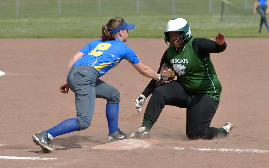 Wiesbaden's Emily Yound puts the tag on Naples' Maria McLeod after she was caught off base in action on opening day of the DODEA-Europe softball tournament in Kaiserslautern, Germany, Thursday, May 25, 2017. Wiesbaden won 10-6.