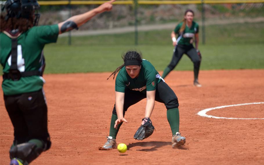 AFNORTH pitcher Rachel Lee fields a ground ball as catcher Jaelyn Woods points where to throw in a game against Hohenfels at the DODEA-Europe softball tournament in Ramstein, Germany, Thursday, May 25, 2017. Hohenfels won a tight game 16-15.