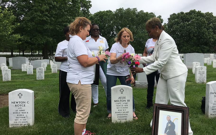 The Gold Star Mothers help Janice Chance, right, lay flowers at the grave of her son, Marine Capt. Jesse Melton III, 29, who was killed in Afghanistan on Sept. 9, 2008.