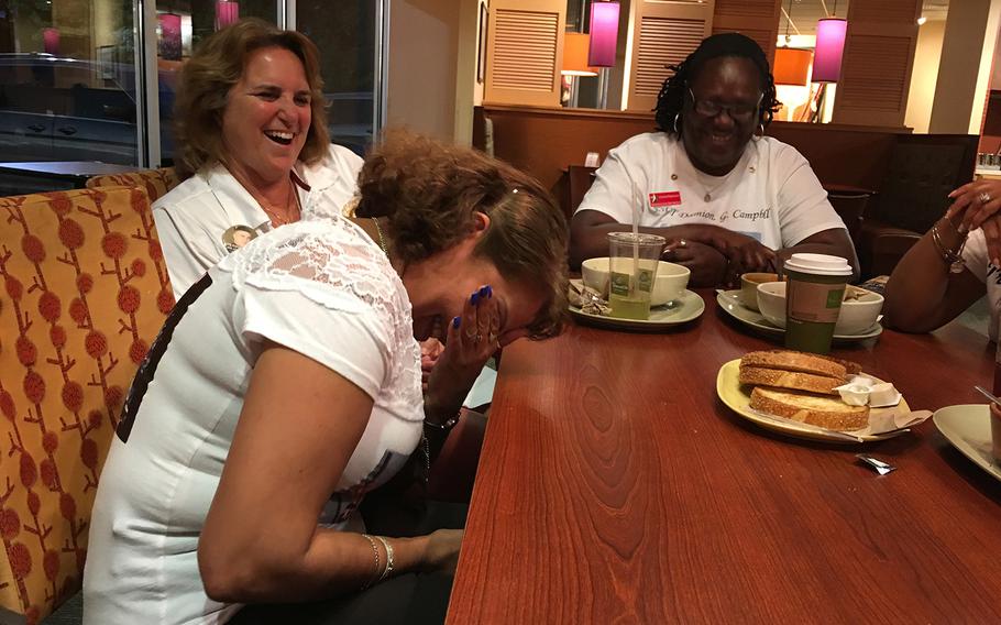 Sheba Khan, left, shares a laugh with the fellow Gold Star Mothers. The women say they understand each other in a way that no one else can.