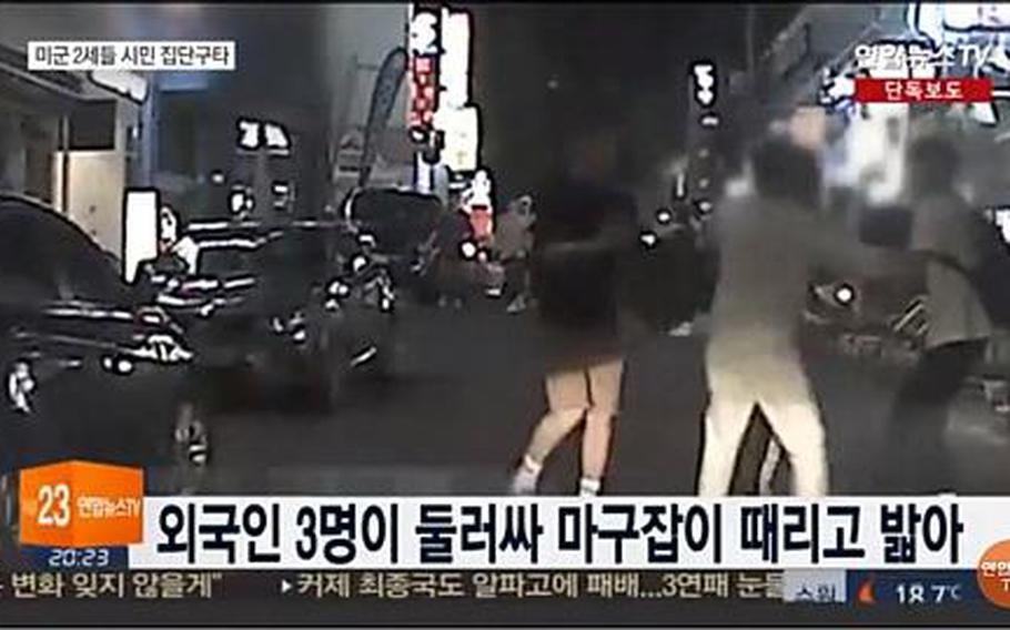 A security camera captures footage of multiple teens assaulting a South Korean man near Sogang University in Seoul on May 23, 2017, according to a Yonhap News TV report on May 28, 2017. The three teens that police arrested are U.S. Forces Korea dependents, military officials said. SCREENSHOT FROM YONHAP NEWS TV VIA YOUTUBE