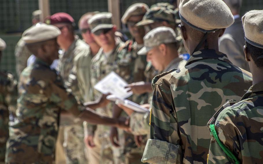 A Somali soldier receives his certificate of completion from a logistics course taught by the U.S. Army's 101st Airborne Division, May 24, 2017, in Mogadishu, Somalia. The six-week course focused on various aspects of moving personnel, equipment and supplies.