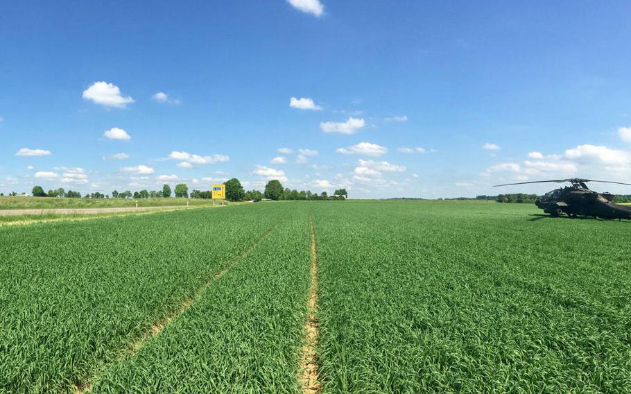 A U.S. Army AH-64 Apache helicopter from Katterbach landed in a farmer's field Wednesday, May 31, 2017, after a sensor went off while on a routine training mission in southern Germany.