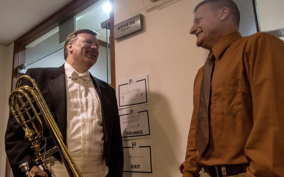 Blair Bollinger, left, a trombonist for the Philadelphia Orchestra, greets Staff Sgt. James Beeson, a trombonist for the 8th Army Band, backstage at the Seoul Arts Center's Music Hall, Thursday, June 8, 2017.