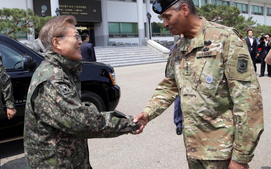 Gen. Vincent Brooks, U.S. Forces Korea commander, greets President Moon Jae-in during the new South Korean leader's first official visit to Yongsan Garrison, Tuesday, June 13, 2017.