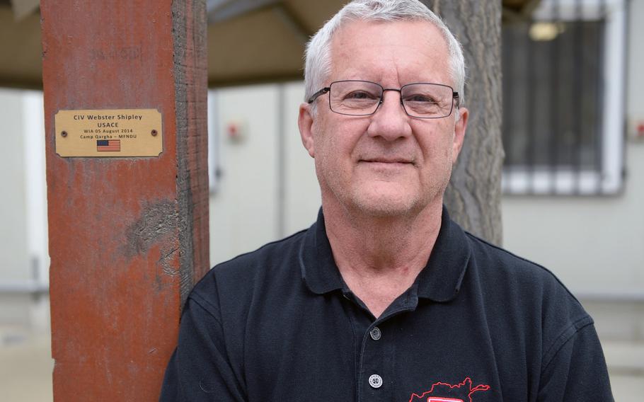 Civilian project manager for the U.S. Army Corps of Engineers Webster E. Shipley, 65, stands in front of a plaque baring his name on April 22, 2014, part of a memorial for victims of a 2014 green-on-blue attack in Kabul. Shipley returned to Afghanistan after being injured in the incident.