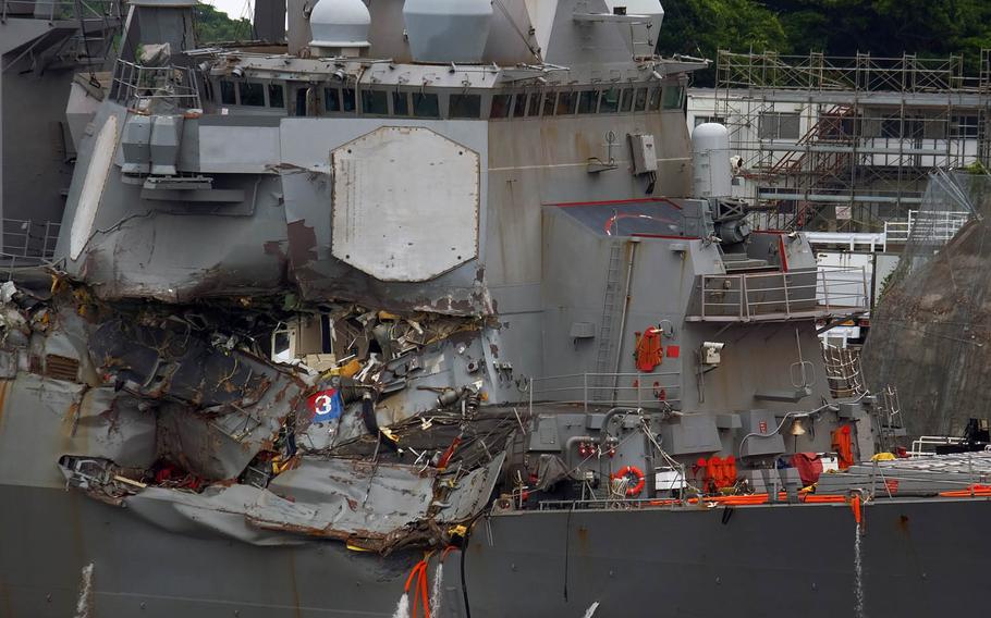 The Navy destroyer USS Fitzgerald, which was involved in an early Saturday collision with a merchant ship, is seen at Yokosuka Naval Base, Japan, Sunday, June 17, 2017.