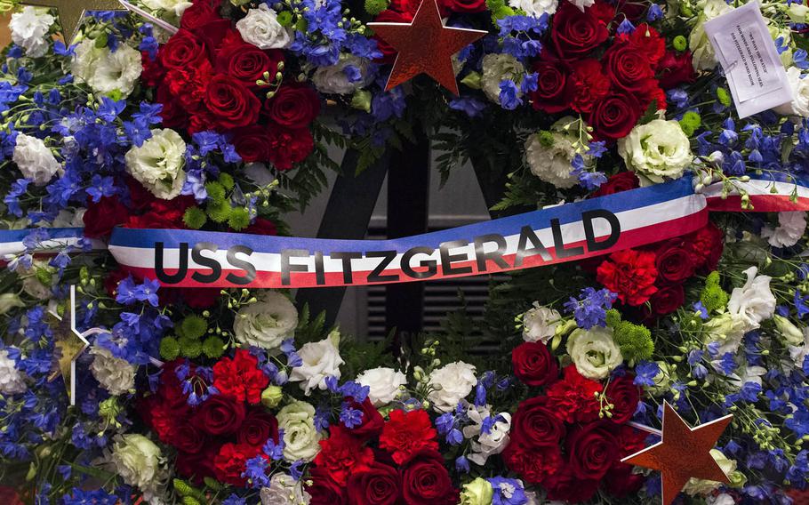 Family, friends and shipmates attend a memorial ceremony for seven USS Fitzgerald sailors at Yokosuka Naval Base, Japan, Tuesday, June 27, 2017.