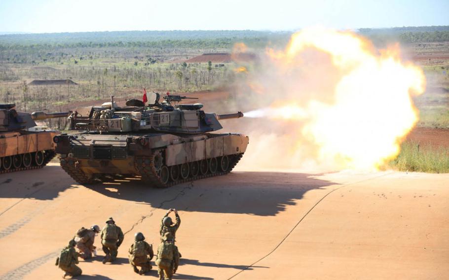 Marine Lance Cpl. Fernando Griego, a gunner with 1st Marine Division, Marine Rotational Force Darwin in Australia, remotely fires an M1A1 Abrams tank with an Australian armored regiment, May 6, 2017.