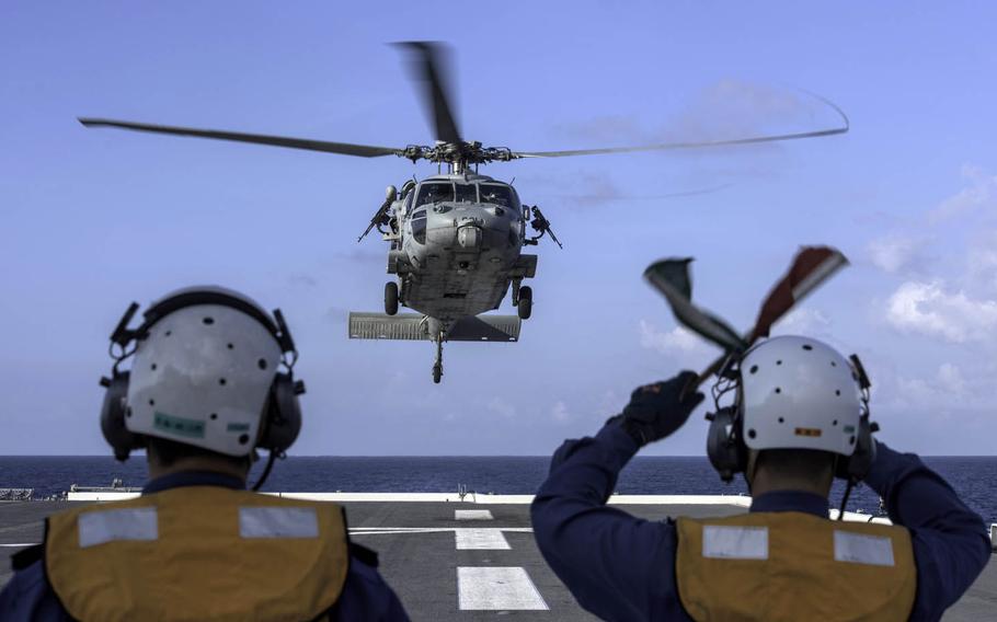 An MH-60S Sea Hawk assigned to the Golden Falcons of Helicopter Combat Squadron 12 takes off from the Japan Maritime Self-Defense Force's JS Izumo in the South China Sea, June 14, 2017.