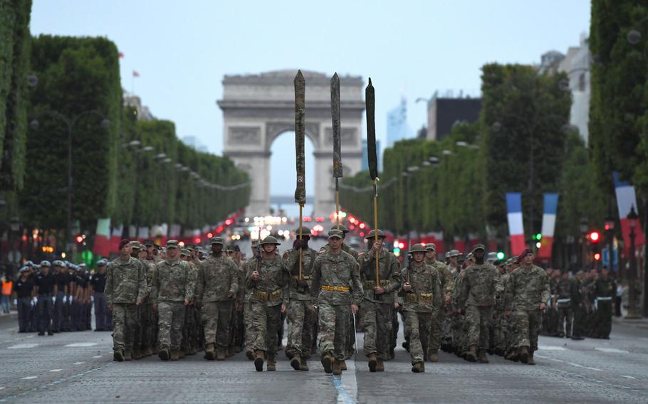Almost 200 U.S. soldiers, sailors, Marines and airmen assigned to units in Europe and the 1st Infantry Division, Fort Riley, Kan., march from the Arc de Triomphe to the Place de la Concorde during a rehearsal for Bastille Day military parade in Paris on Wednesday, July 12, 2017.