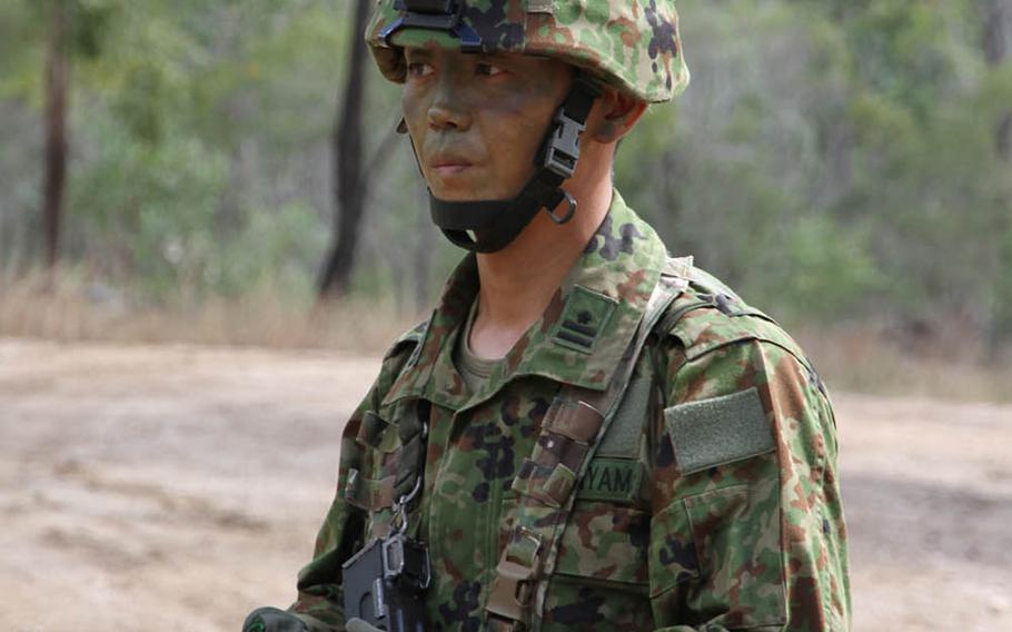 Maj. Yohei Hatayama, a Japan Ground Self-Defense Force company commander with Japan's elite 1st Airborne Brigade, 3rd Battalion, emerges from the Australian bush during Talisman Saber drills at Shoalwater Bay Training Area, Friday, July 14, 2017.