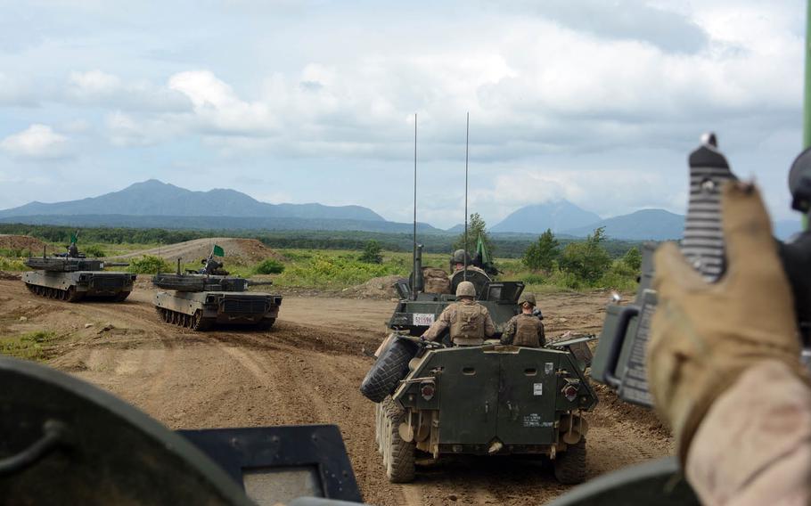 U.S. Marines and Japan Ground Self-Defense Force troops take part in the Northern Viper exercise in Hokkaido, Japan, Wednesday, Aug. 16, 2017.