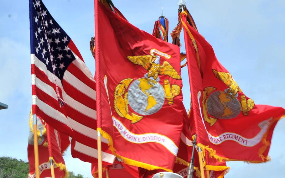 Flags from the Okinawa-based 3rd Marine Division's color guard are seen during a Liberation Day parade in Hagatna, Guam, July 21, 2017.