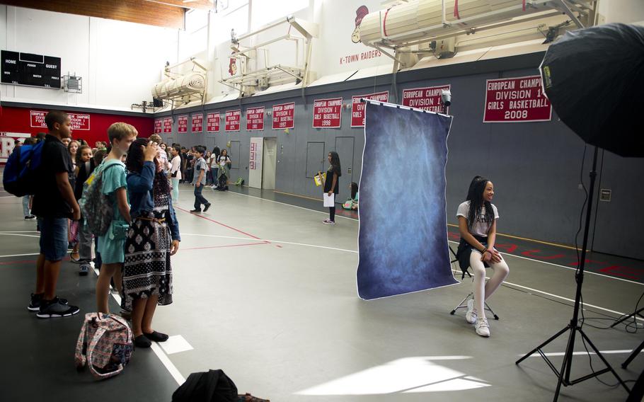 Sixth-grade students at Kaiserslautern Middle School get their pictures taken during the first day of school at Vogelweh, Germany, on Monday, Aug. 28, 2017.
