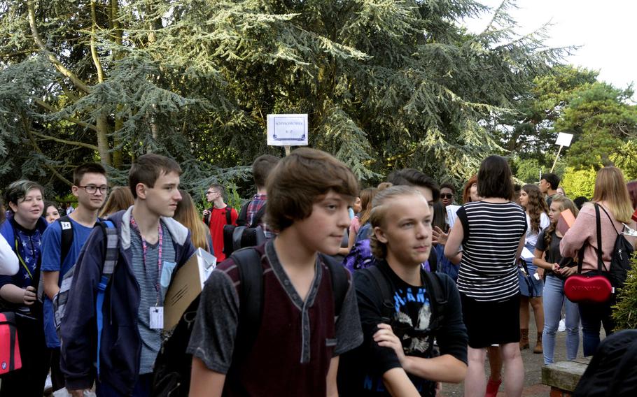 Lakenheath American High School students walk to their assigned areas for orientation on the first day of school at RAF Lakenheath, England, Monday, Aug. 28, 2017.