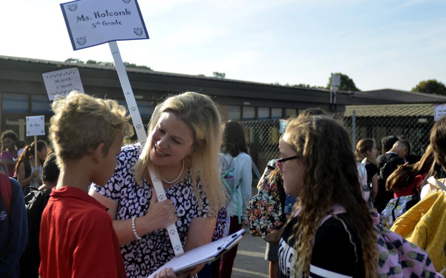 Fifth-grade teacher Shannon Holcomb meeting her new students during the first day of class at the Liberty Intermediate School in RAF Lakenheath, England, Monday, Aug. 28, 2017.
