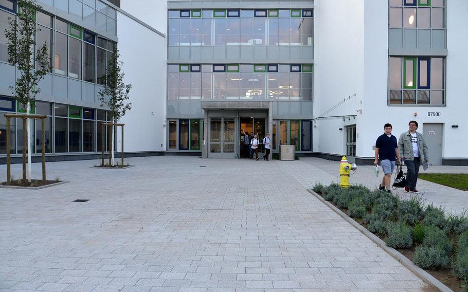 Students walk out of the new Wiesbaden High School toward the gym, where an assembly was held before all of the students entered the new school for orientation and class, Monday, Aug. 28, 2017.