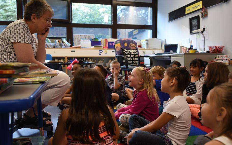 With her first-graders gathered around on the first day of school on Monday, Aug. 28, 2017, Ramstein Elementary School teacher Janet Bridges tries to remember names of all of her students.