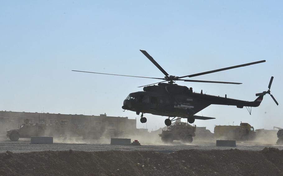 An Iraqi army Mi-17 helicopter transporting Lt. Gen. Abdulmanir Yarallah, commander of the operation to liberate Tal Afar, west of Mosul, lands at a joint Iraqi and coalition tactical base at Buwayd on Sunday, Aug. 27, 2017. Yarallah met with Army Col. Pat Work and other U.S. advisers Sunday afternoon, the eighth day of fighting in Tal Afar, when the town was declared fully liberated.