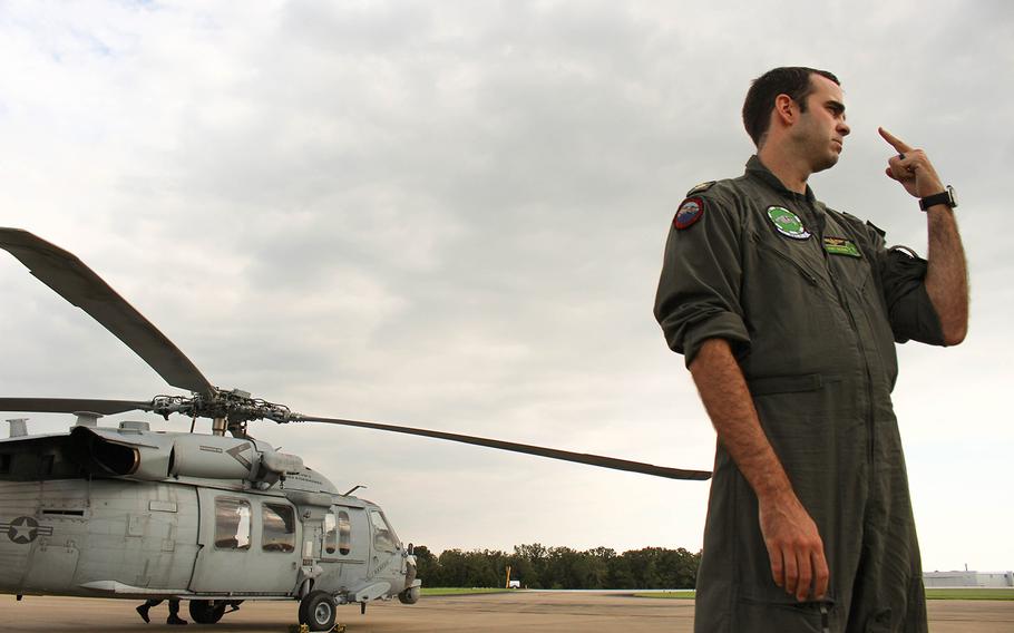 Navy pilot Lt. Cmdr. Pat Dunn talks about relief efforts during Huricane Harvey. Dunn is a part of the Dusty Dogs of the Helicopter Sea Combat Squadron, based of out Norfolk, VA, who assisted in the rescue mission.