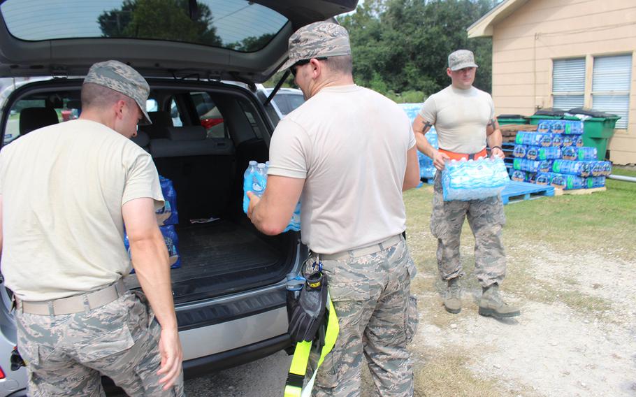 Members of the 136th Airlift Wing of the Texas National Guard provide emergency ration meals to residents of China, Texas, on Sept. 3, 2017.