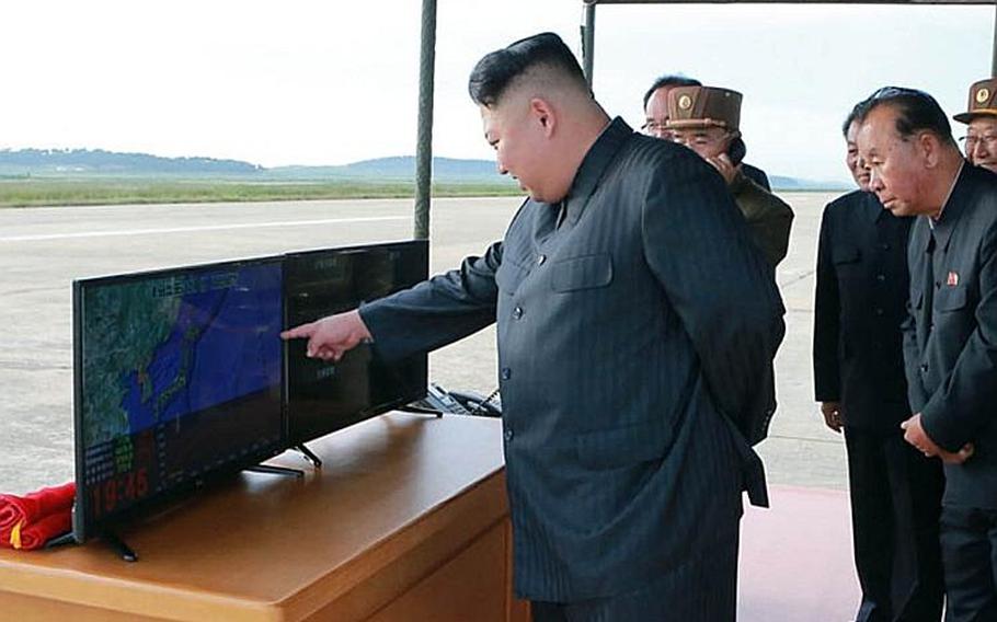 This image of North Korean leader Kim Jong Un and other officials was released by the Korean Central News Agency a day after Pyongyang test-fired a missile over Japan on Friday, Sept. 15, 2017.