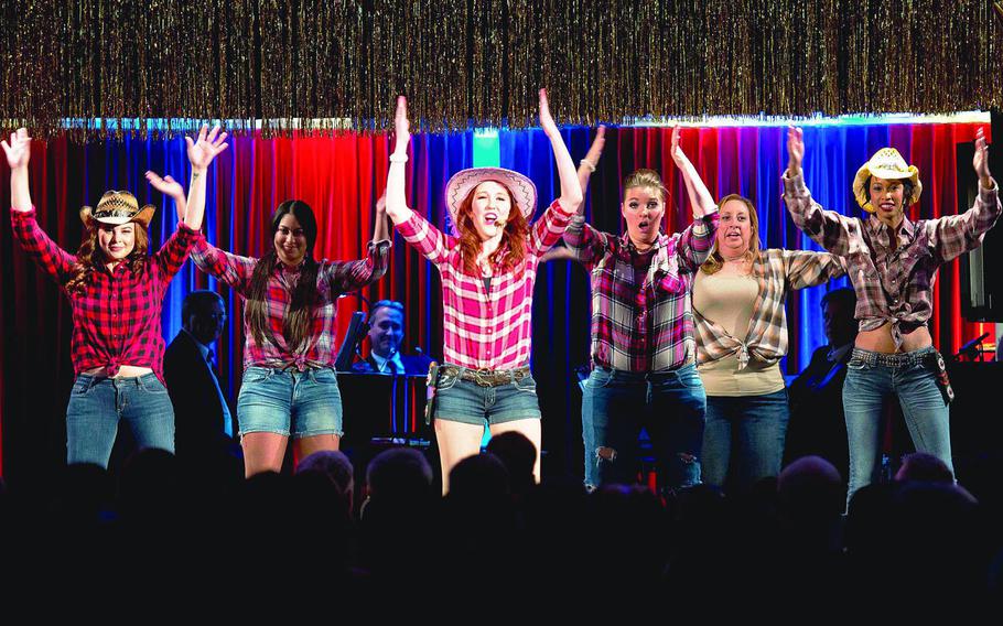 The Grafenwoehr Performing Arts Center cast of ''Dirty Rotten Scoundrels'' performs during the Toppers awards in Kaiserslautern, Germany, in 2016. Theater lovers in the Kaiserslautern Military Community can participate in various workshops and see a showcase performance during the Army's annual theater festival in Europe during Columbus Day weekend next month.