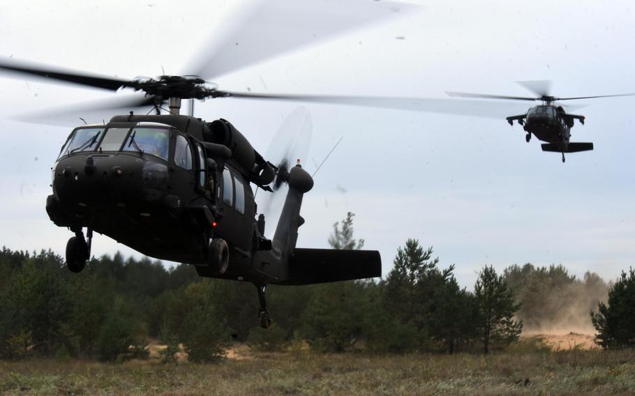 U.S. Army UH-60 helicopters land to transport U.S. and Slovenian soldiers during Exercise Bayonet Shield in Adazi, Latvia, Sept. 19, 2017.