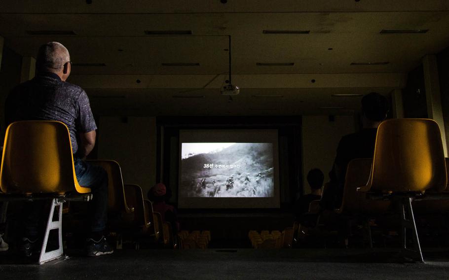 Tourists watch a video about the Korean War at Goseong, South Korea, Saturday, Aug. 26, 2017.