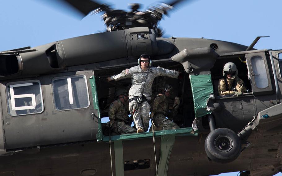 An air-assault instructor inspects a landing zone for his students at Camp Mobile, South Korea, Thursday, Oct. 19, 2017.