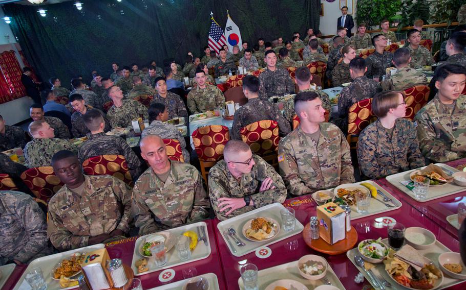 Troops wait for U.S. and South Korean leaders Donald Trump and Moon Jae-in to join them for lunch at Camp Humphreys, South Korea, Tuesday, Nov. 7, 2017.