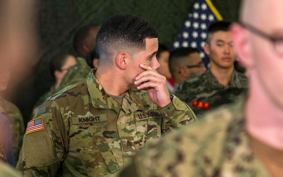 The American soldier who sat next to President Donald Trump during lunch at Camp Humphreys, South Korea, waits for the U.S. leader to arrive, Tuesday, Nov. 7, 2017.
