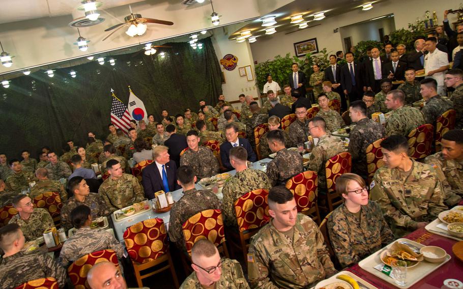 President Donald Trump speaks with South Korean President Moon Jae-in and troops from both nations over lunch at Camp Humphreys, South Korea, Tuesday, Nov. 7, 2017.