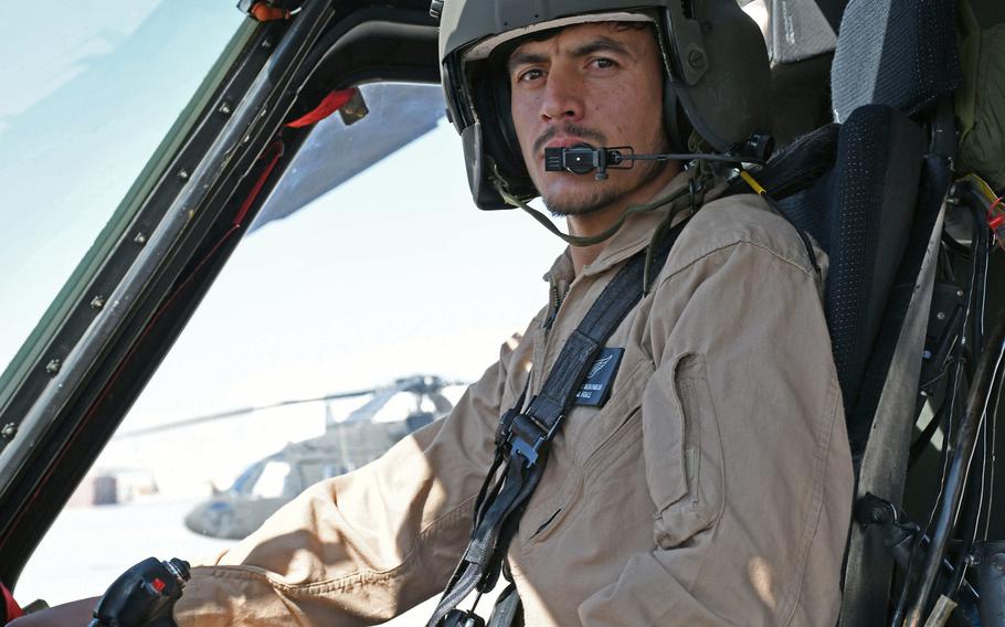 Capt. Zabihullah Dorandish, who is training to fly the UH-60A Black Hawk, finishes practicing maneuvers at Kandahar Air Field, Afghanistan, on Sunday, Nov. 5, 2017.
