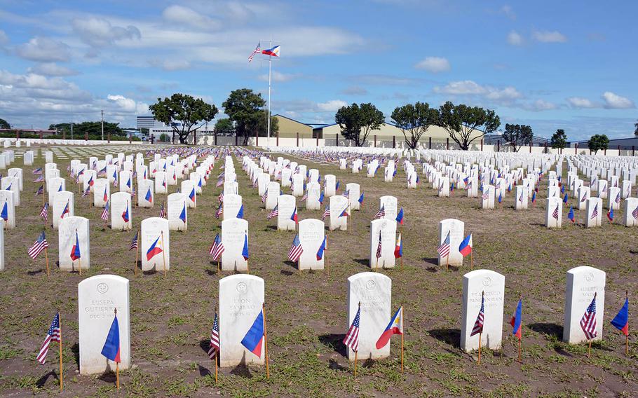 American and Philippines flags fly at Clark Veterans Cemetery, Saturday Nov. 11, 2017.