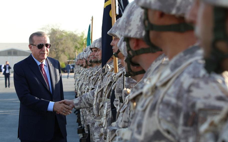 President Recep Tayyip Erdogan greets soldiers during a visit to the Turkish military base in Doha, Qatar, on Friday, Nov. 17, 2017.