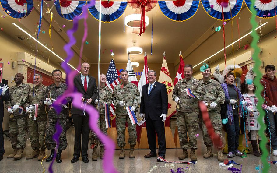 The ribbon is cut at the new post exchange at Camp Humphreys, South Korea, Monday, Nov. 20, 2017.