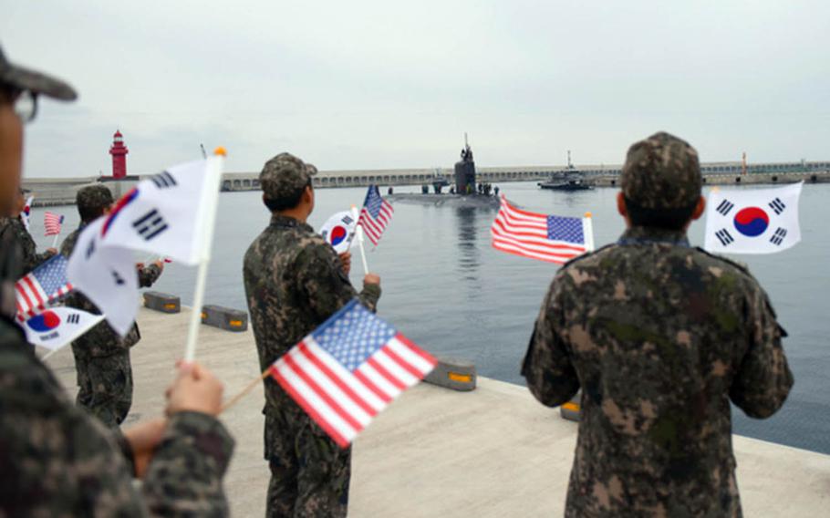 The Virginia-class attack submarine USS Mississippi pulls into the pier at South Korea's Jeju Naval Base as part of a routine port visit, Nov. 22, 2017.