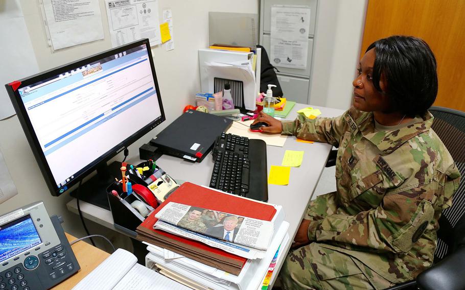 Army Capt. Marquita Gillespie, patient administration officer with the 7227th Medical Support Unit, shows how the Health Experts onLine Portal is used at Landstuhl Regional Medical Center. The 7227th used the portal to give soldiers deployed to forward areas access to medical specialists for treatment.