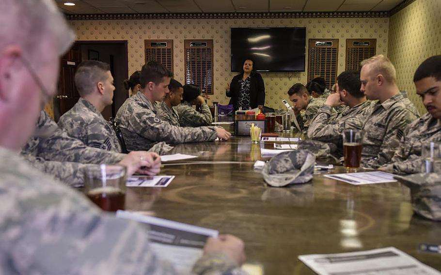 Patricia Maxwell, a personal financial counselor, talks to a group of airmen about the new Blended Retirement System at the Silver Spruce Golf Course on Peterson Air Force Base, Colo., April 21, 2017.