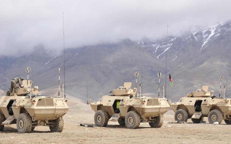 The Afghan army's Armored Branch School conduct a demonstration of the capabilities of the Mobile Strike Force Vehicles, during a simulated attack, and a live fire exercise, using a mock up of the area in a sand pit near Kabul in 2014.