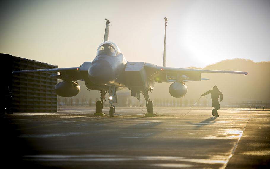 A maintenance airman prepares a F-15C Eagle for takeoff at Gwangju Air Base, South Korea, Tuesday, Dec. 5, 2017.