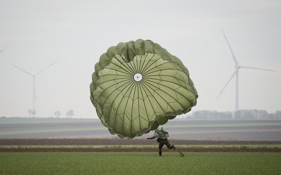 A German soldier lands in a field near Alzey, Germany, on Wednesday, Dec. 6, 2017.