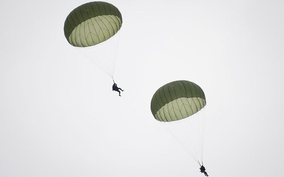 Paratroopers land near Alzey, Germany, on Wednesday, Dec. 6, 2017.