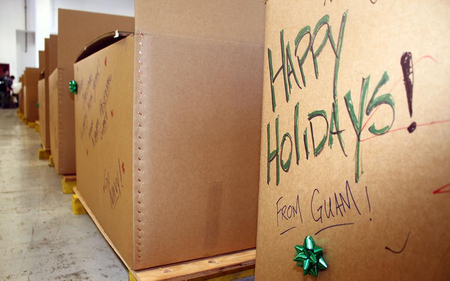 Operation Christmas Drop bundles wait inside a hangar at Andersen Air Force Base, Guam, in December 2016.