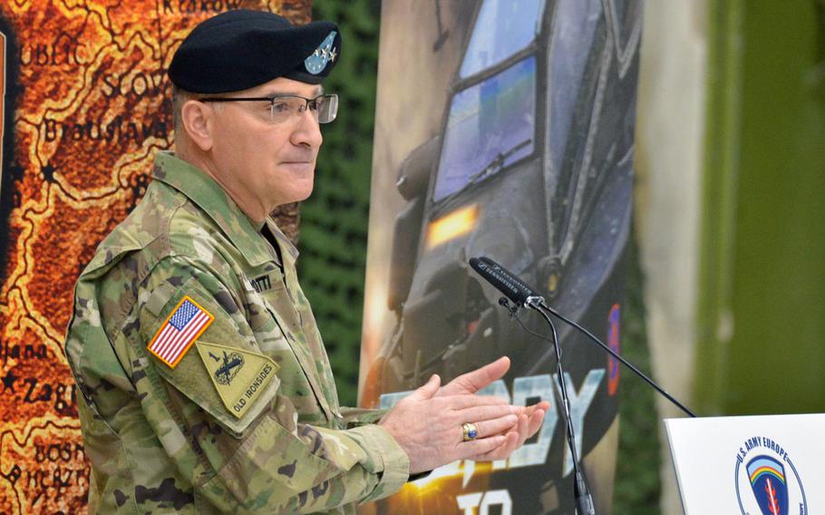 Gen. Curtis Scaparrotti, commander of U.S. European Command, applauds the soldiers of U.S. Army Europe during the relinquishment of command and retirement ceremony for USAREUR commander Lt. Gen. Ben Hodges at Clay Kaserne in Wiesbaden, Germany, Friday, Dec. 15, 2017.